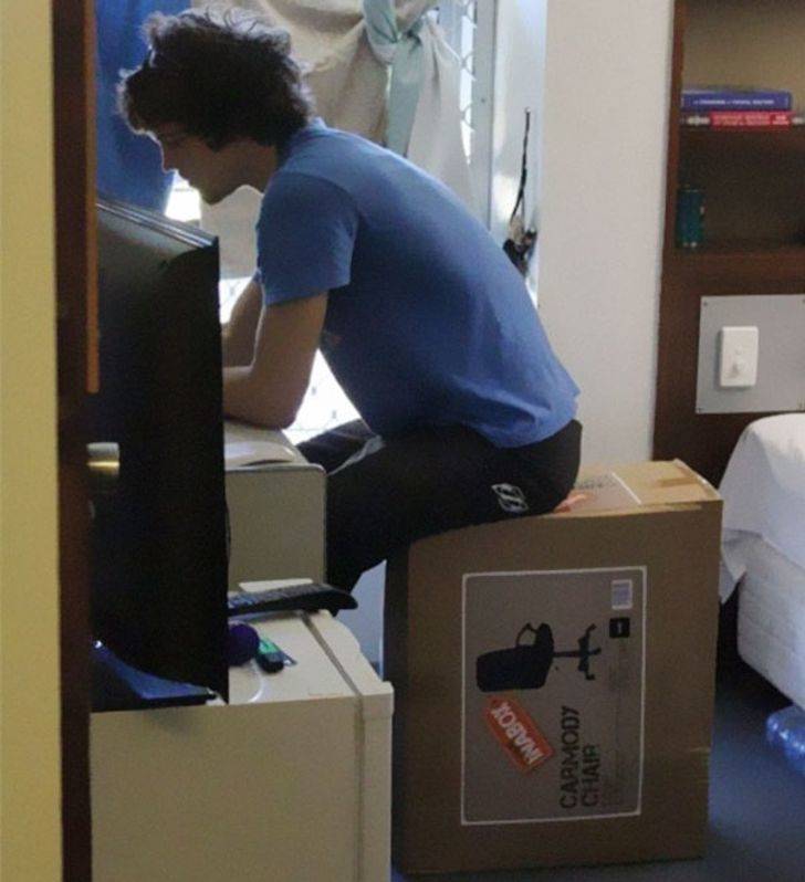 man sitting on the box a chair comes in