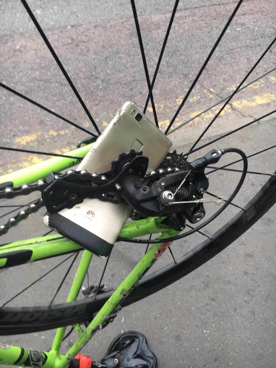 phone fell and got stuck in bike tire while riding