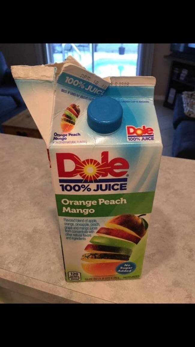 dole juice carton with ripped open flap instead of using pour cap