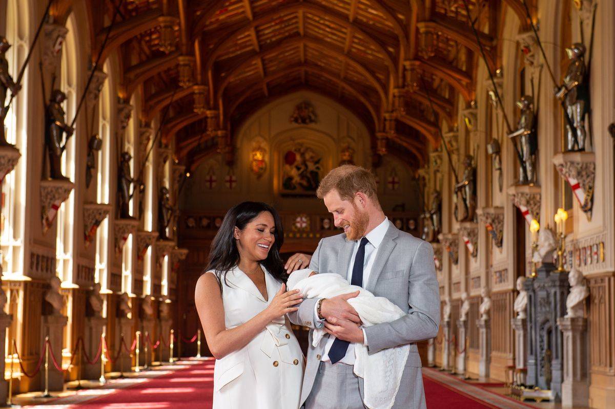 Prince Harry and his wife Meghan pose for a photo with their newborn baby son, Archie Harrison Mountbatten-Windsor.