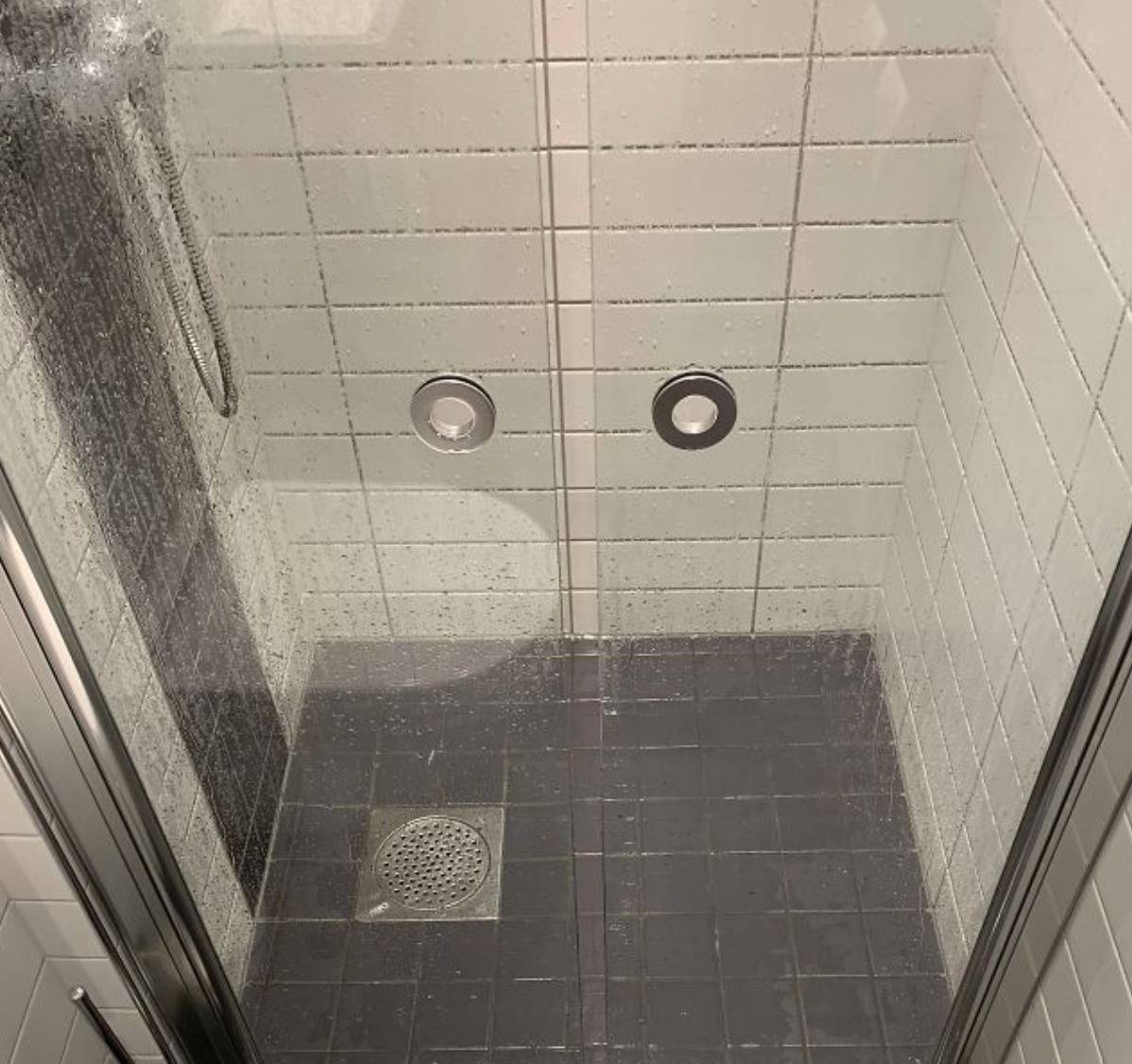 one inch gap between two shower doors