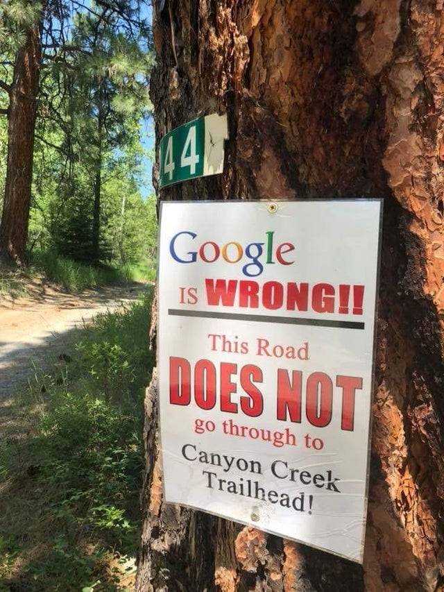 sign on tree: Google is WRONG! this road does not go through to canyon creek trailhead