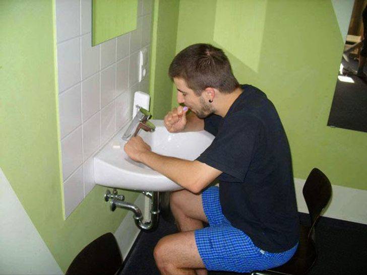 sitting brushing teeth