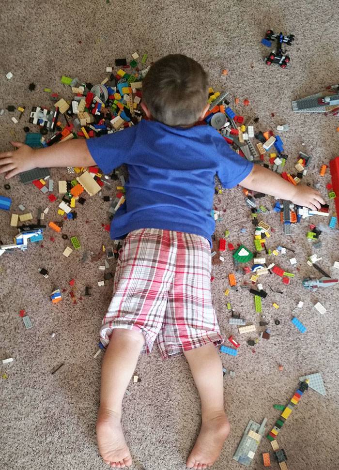 sleeping child on LEGOs