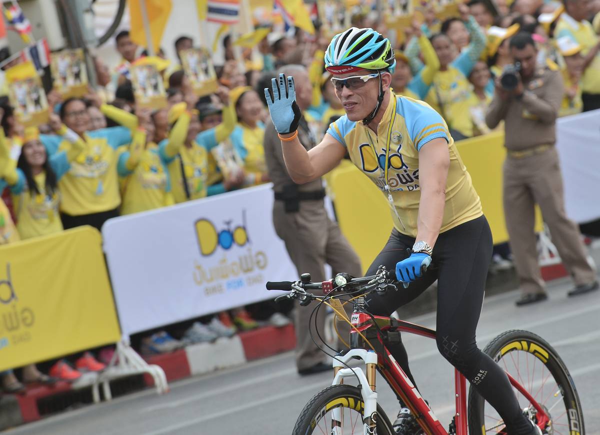 Thailand Crown Prince, Maha Vajiralongkorn cycles during the cycling event 'Bike for Dad' in Bangkok.
