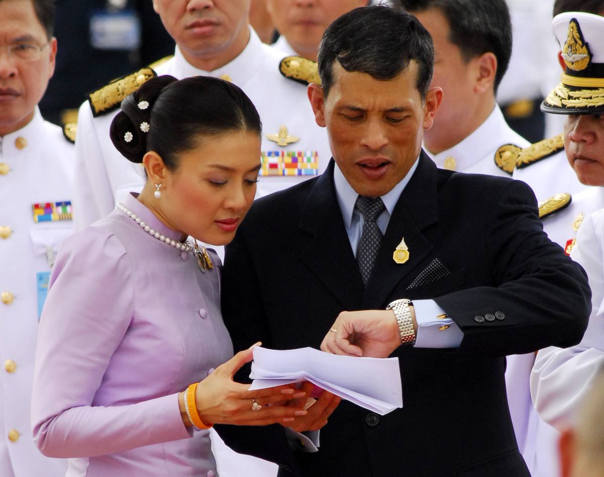 Crown Prince Maha Vajiralongkorn of Thailand, checks his watch.