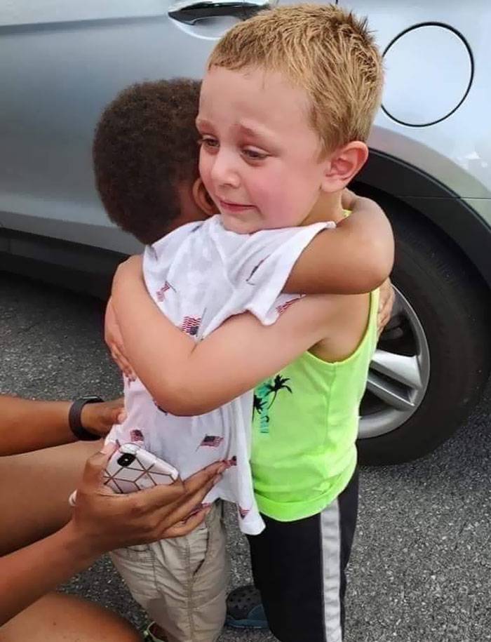 two boys hugging