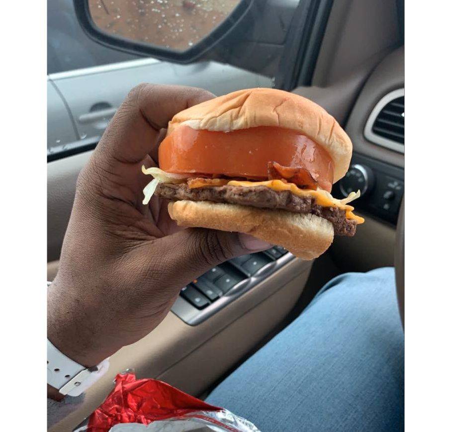 small burger with large tomato slice