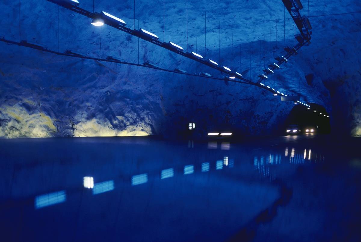 Cars drive down the Lærdal Tunnel, the longest road tunnel in the world.