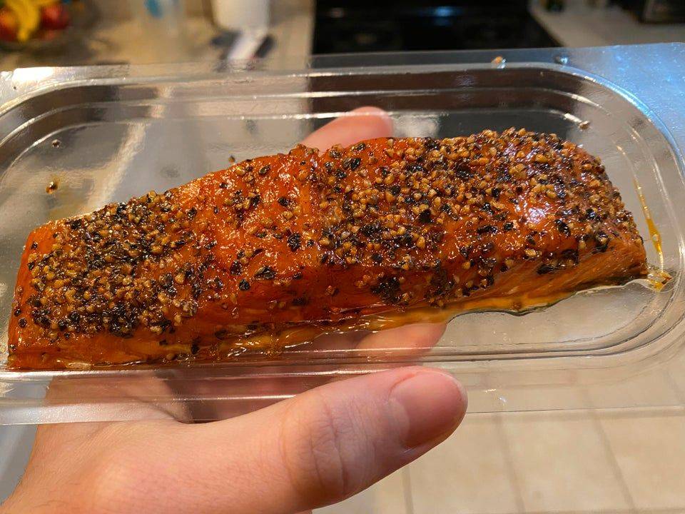 salmon wrapped tightly in plastic