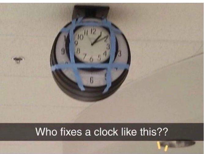 clock taped onto a broken clock