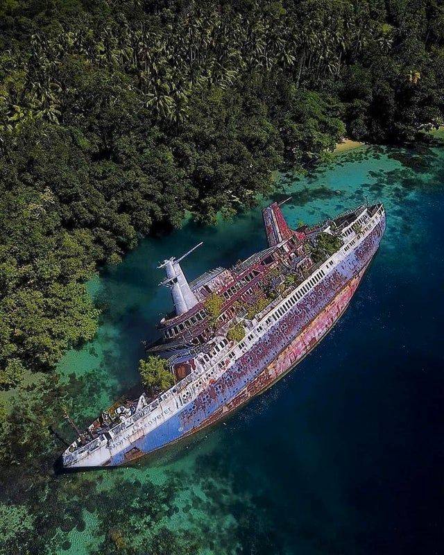 photo of boat in the water from above
