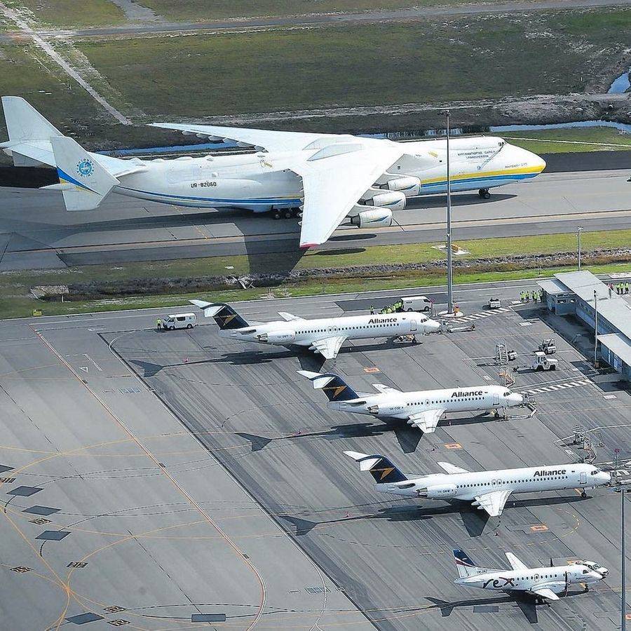 big airplanes next to smaller airplanes