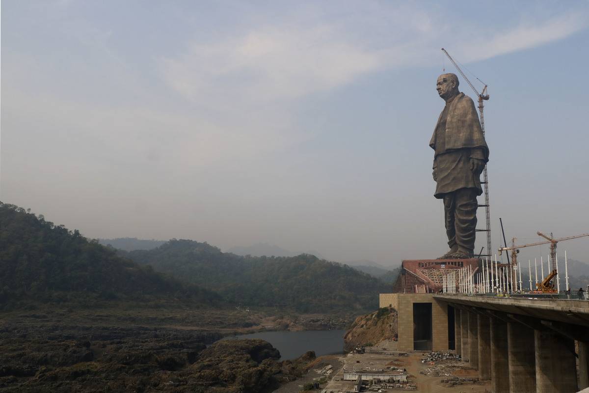 The Statue of Unity is erected with a crane.