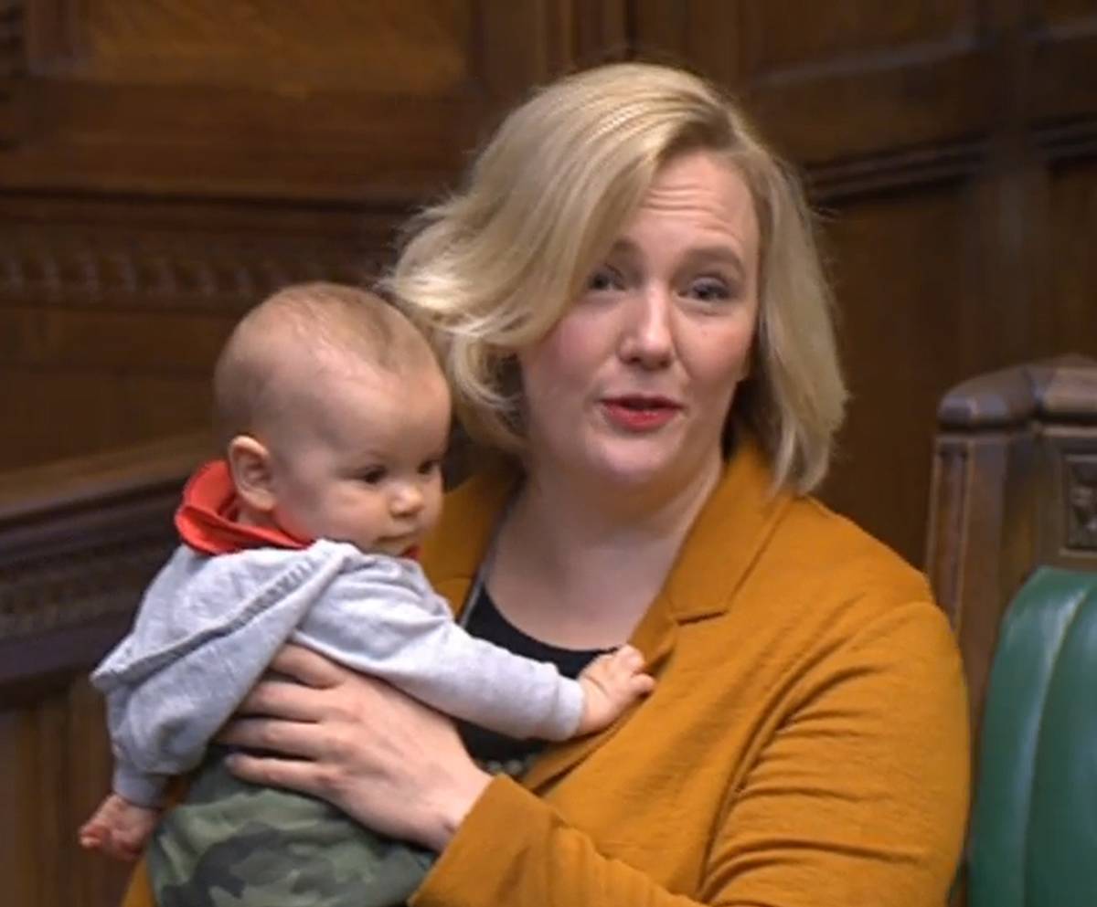 Labour MP Stella Creasy holds her baby daughter in the House of Commons in London