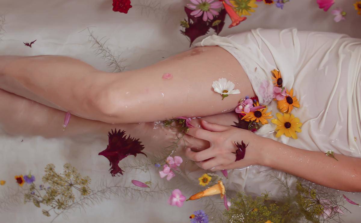 body legs in bath with flowers