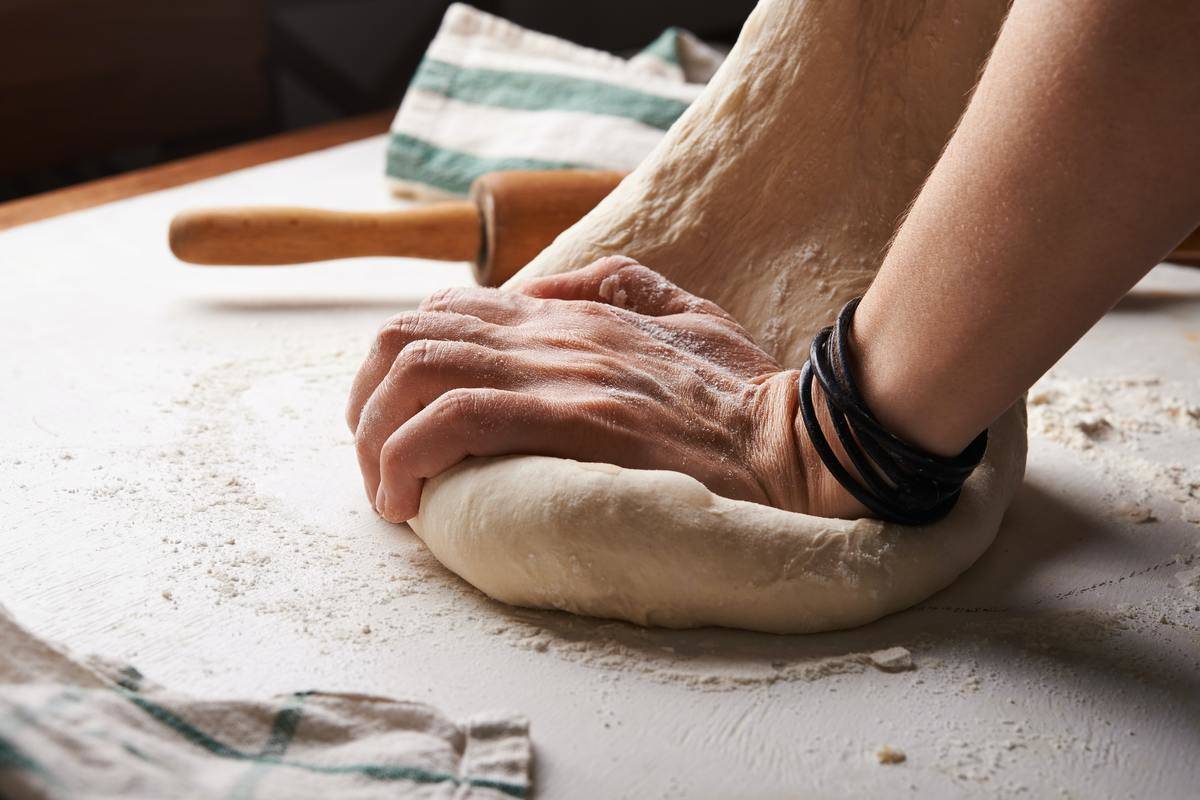 woman kneeding dough