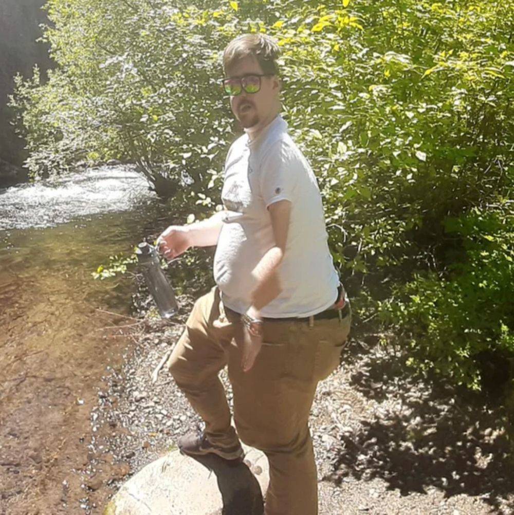 man standing by river