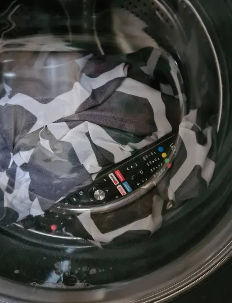 television remote with clothes inside washing machine
