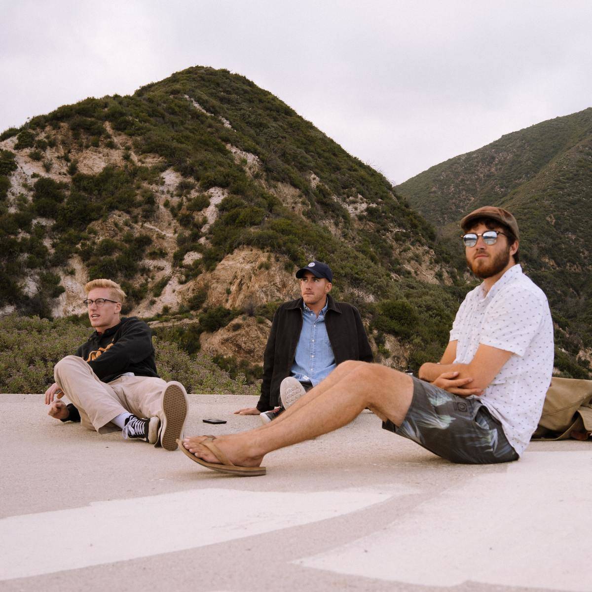 group of young men sitting together