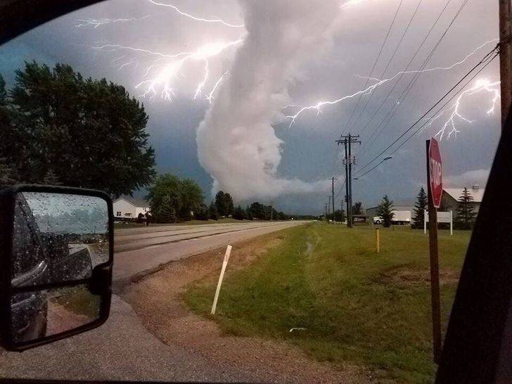 storm with funnel clouds and lots of lightning