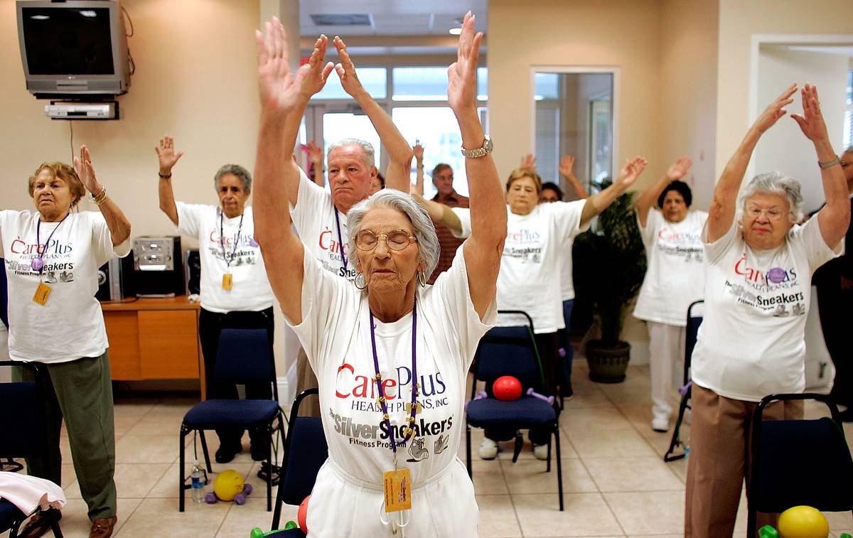 Seniors stretch during an exercise class.