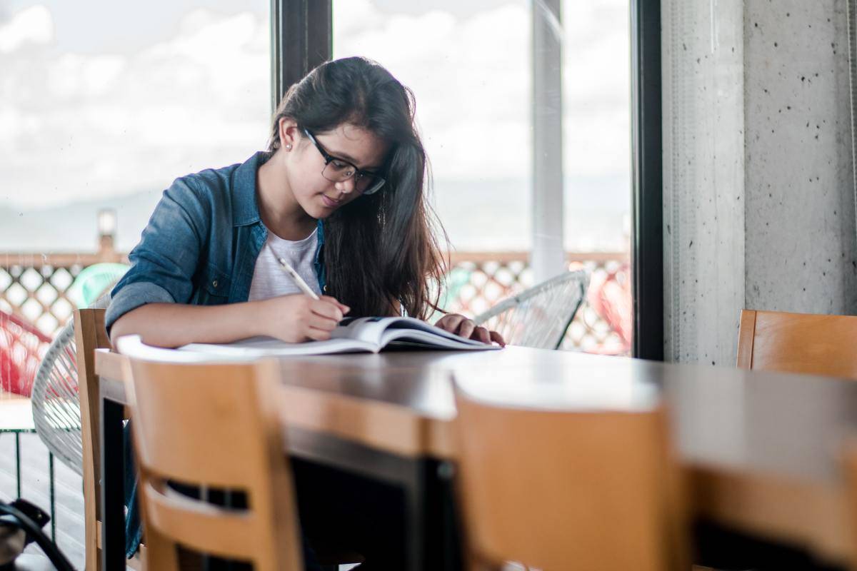 young woman studying at table