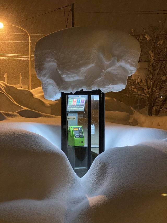 snow on phone booth