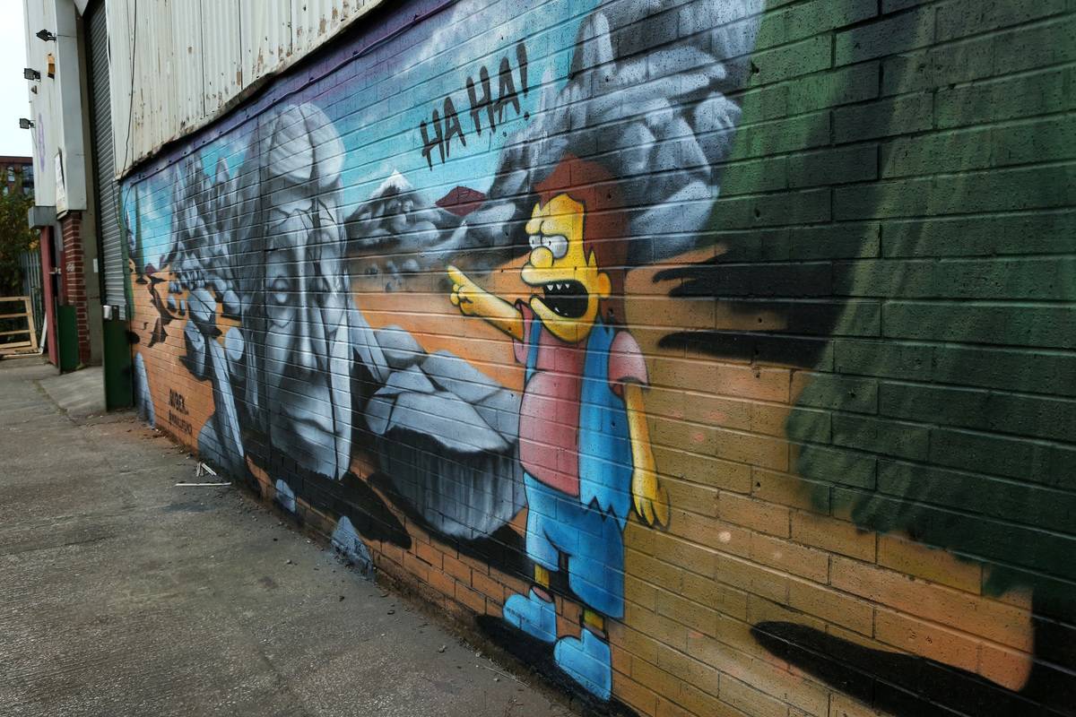 A mural depicting Donald Trump being laughed at by a character from The Simpsons is seen at Islington Mill on November 08, 2020 in Salford, England.