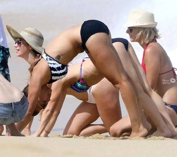 people stretching on beach