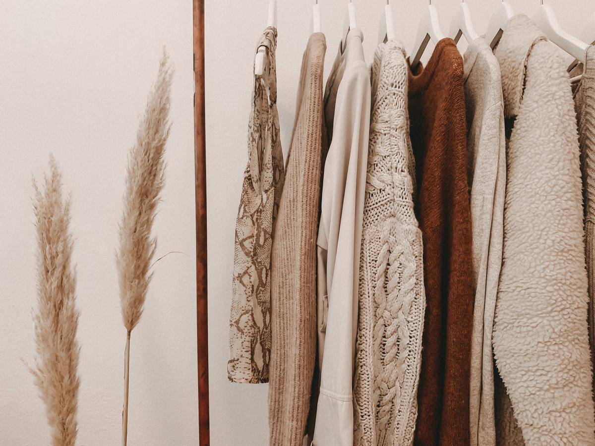 Clothes hung up in beige clothes