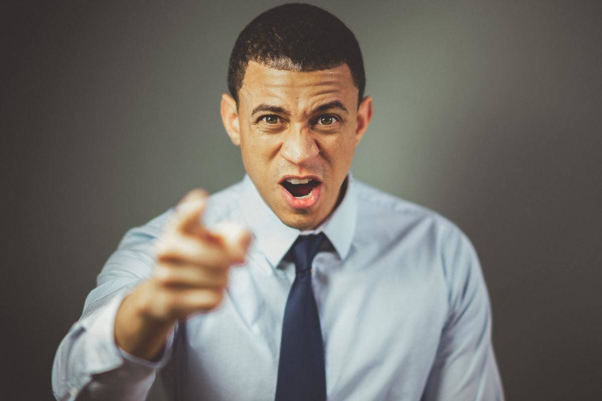 Man pointing in anger stock image