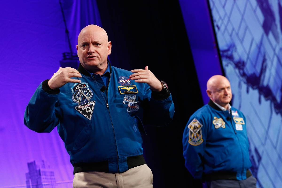 Astronauts Captain Scott Kelly and Captain Mark Kelly speak on stage at LocationWorld 2016.
