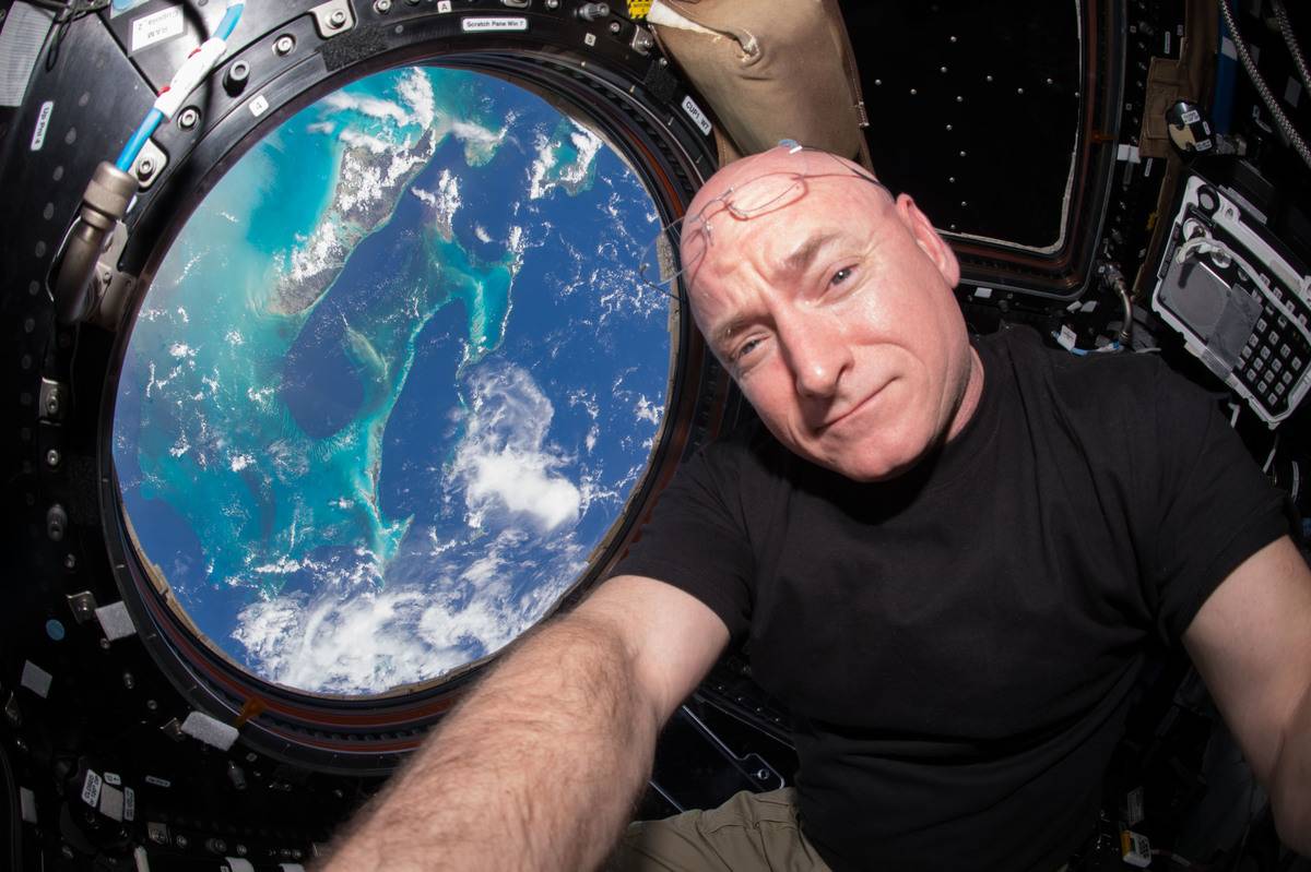 Scott takes a photo of him in the International Space Station.