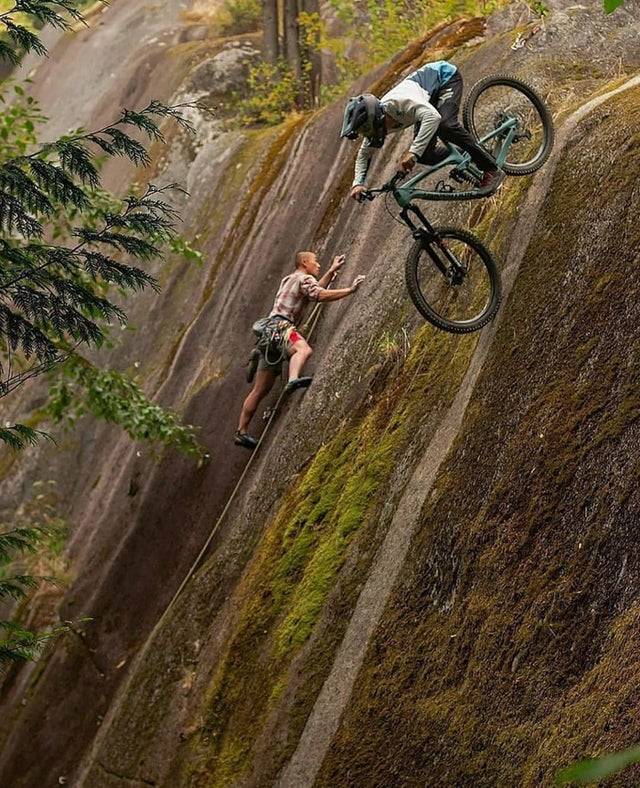 biker and hiker going different ways on the hill