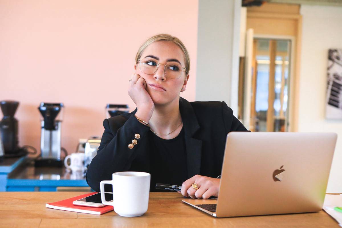 woman frowning at desk