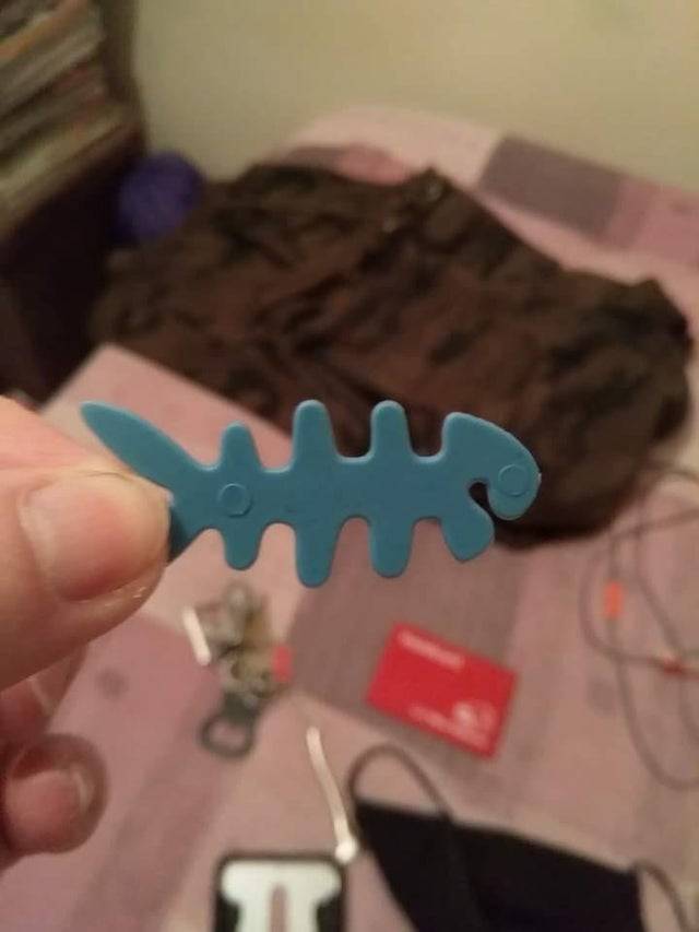 blue plastic fish shaped tool