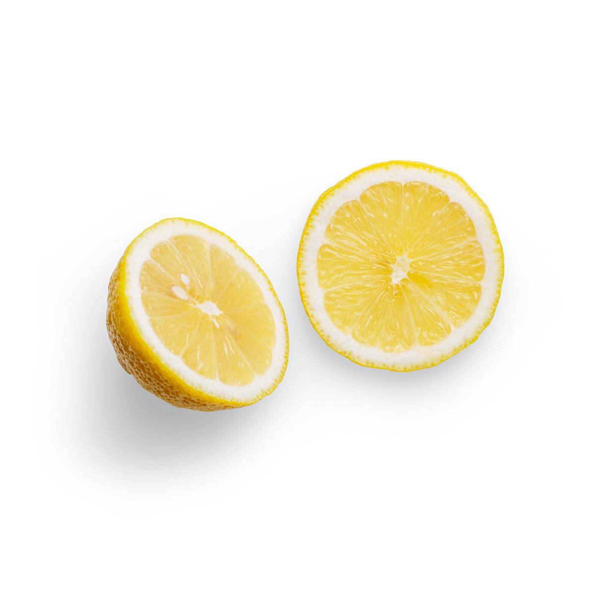 lemon sliced in half on white background