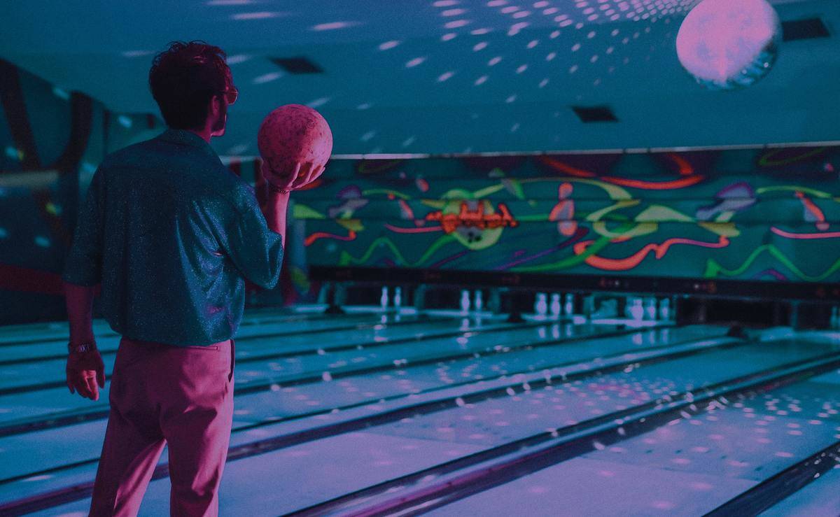 man holding bowling ball ready to throw