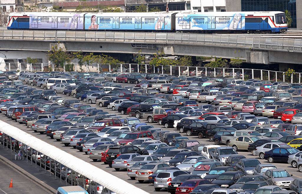the Bangkok Sky Train driving past a carpark area for the line's passengers in Bangkok
