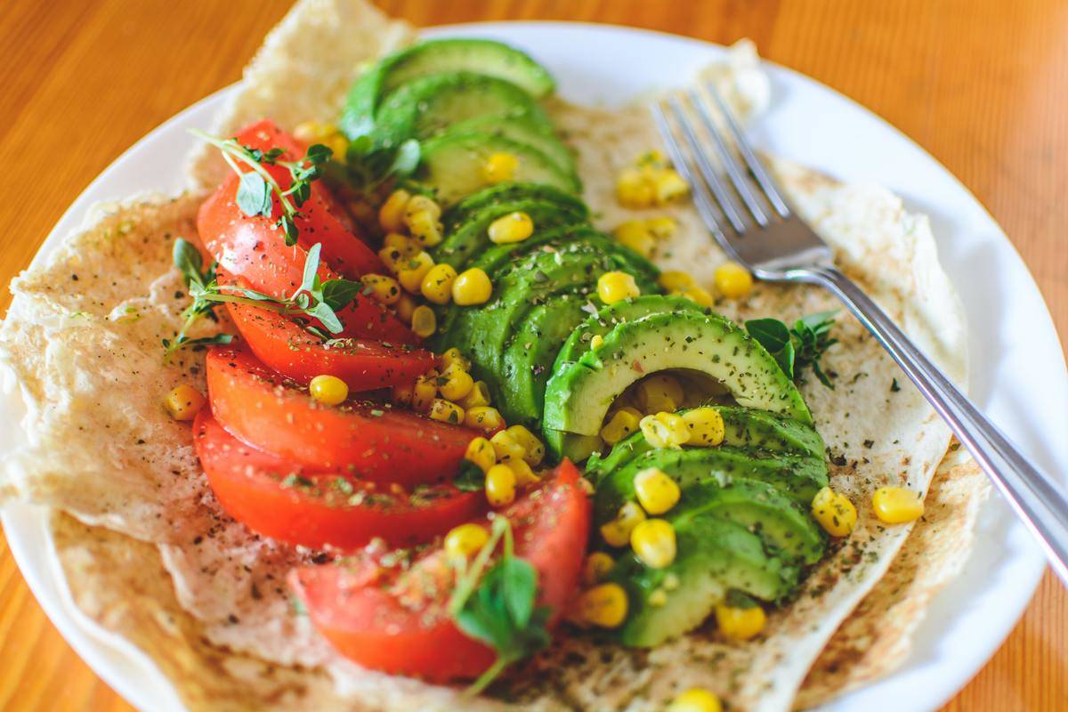 avocado corn and tomato on tortilla