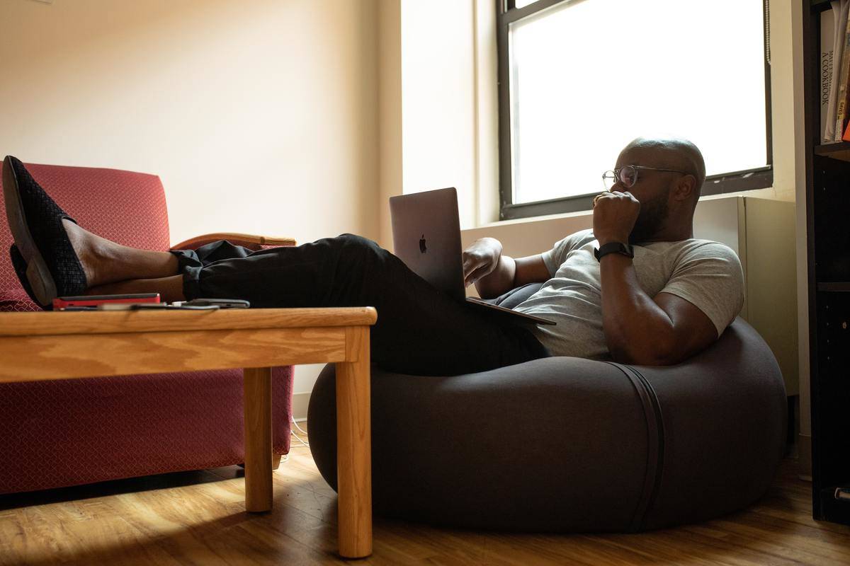 man with laptop on beanbag
