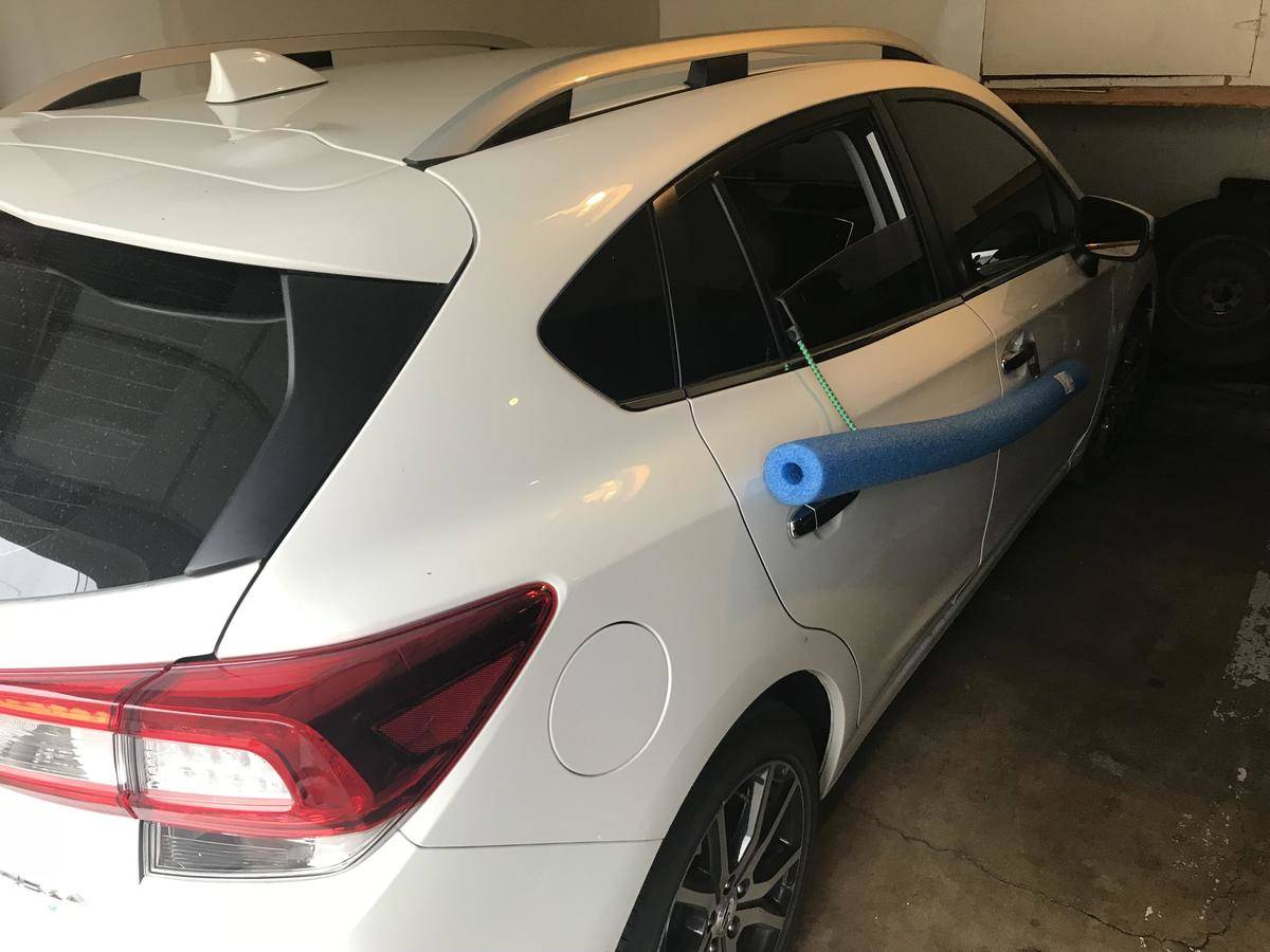 a pool noodle attached to a car