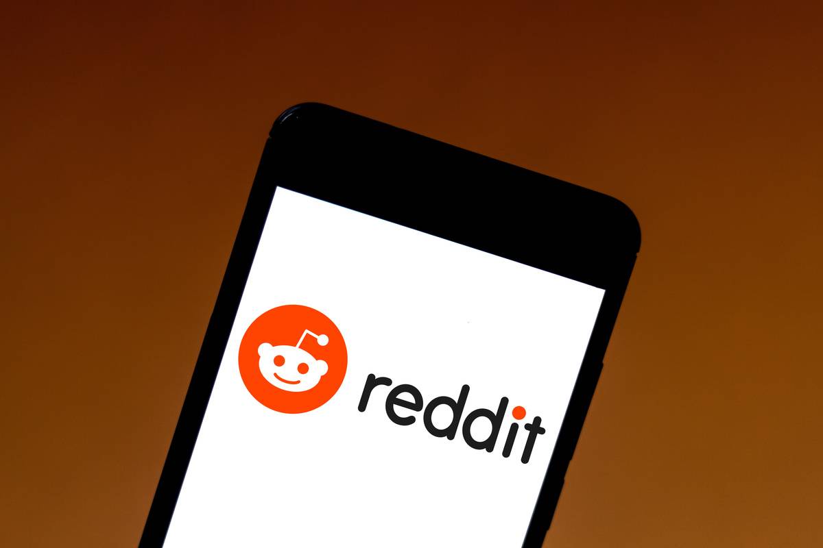 Reddit logo is seen displayed on a smartphone