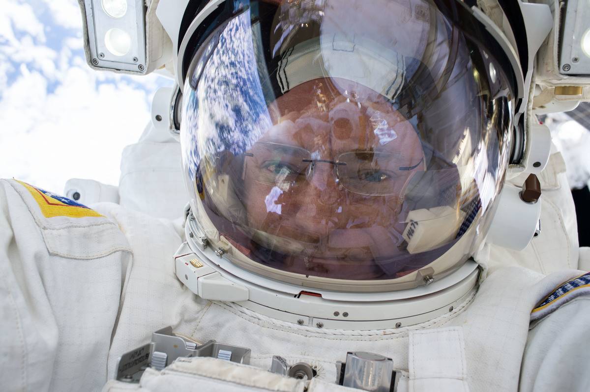 Scott Kelly takes a picture in his space suit before liftoff.