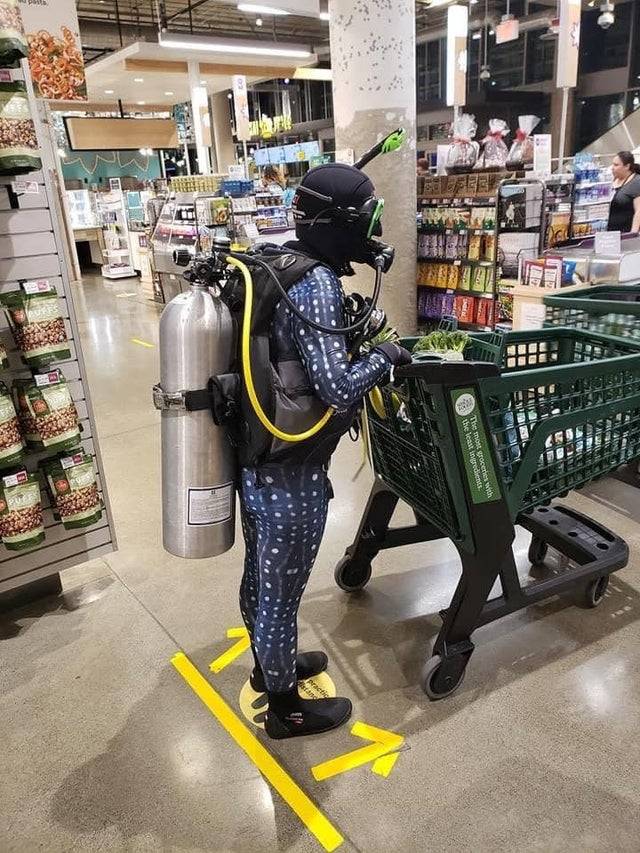 guy wearing scuba gear at grocery store