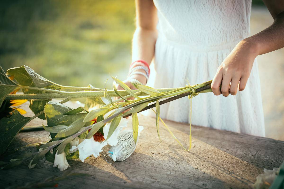 ninewoman holding flowers on a table