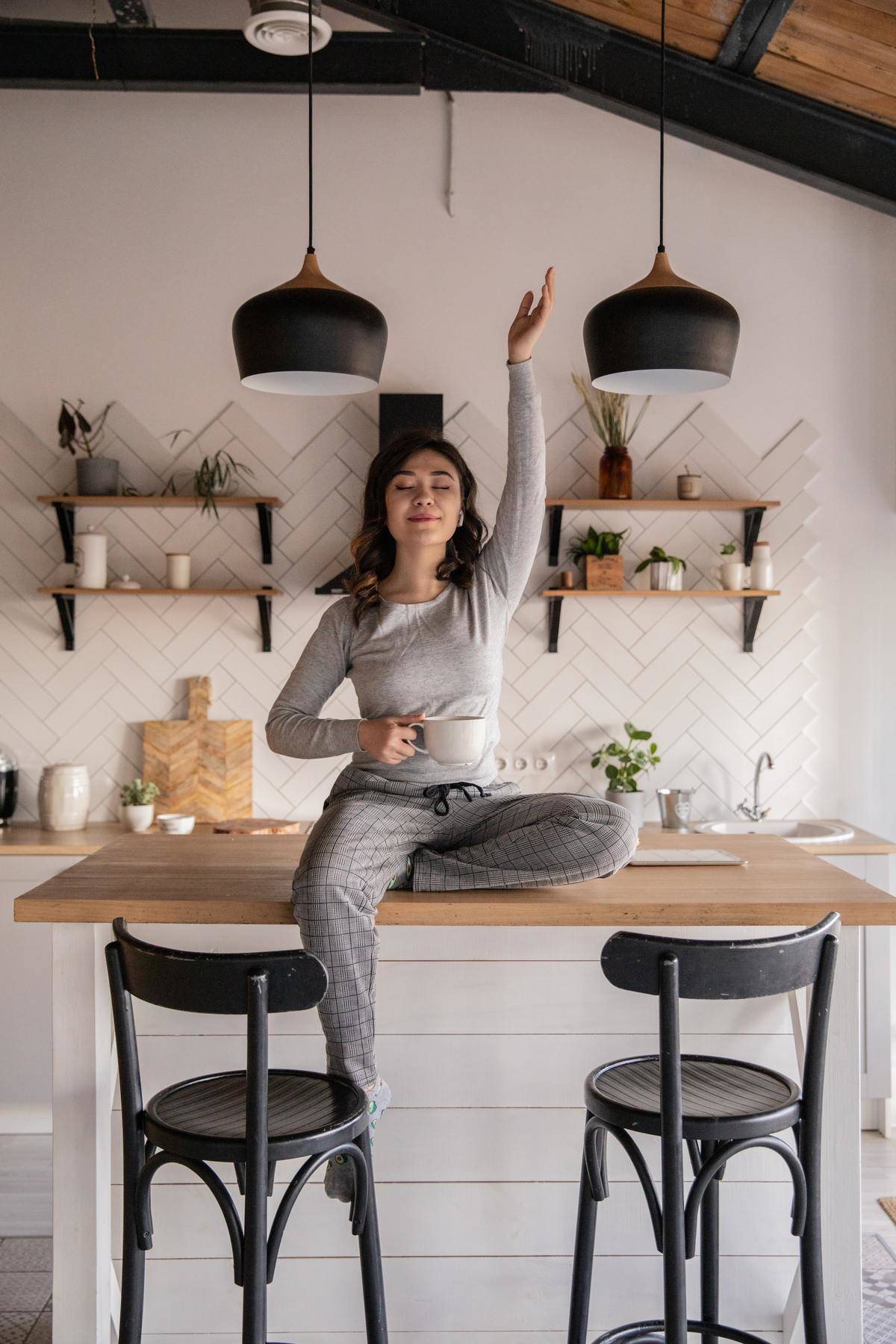 woman in pjs sitting on counter