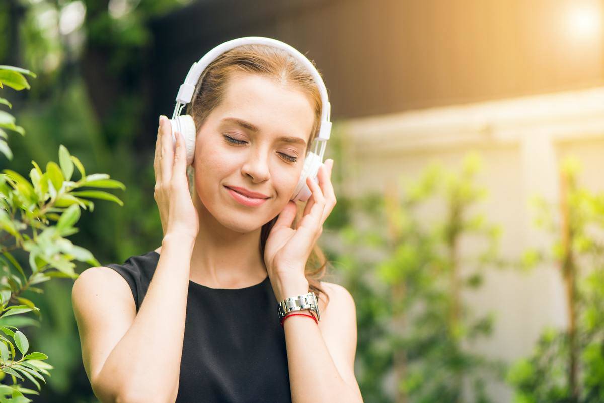 woman listening to music on headphones