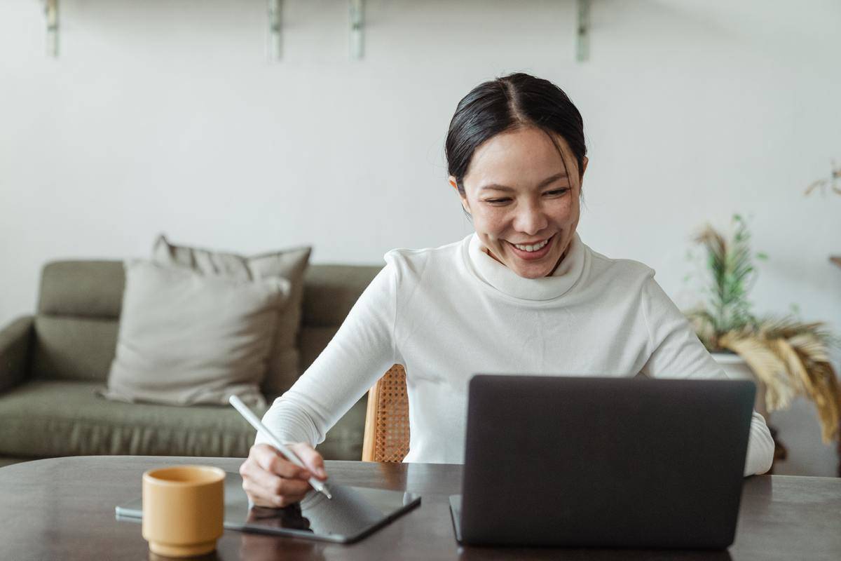 woman speaking at computer screen